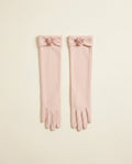 Pair of blush above-elbow opera gloves with a small rosette detail on a cream studio backdrop